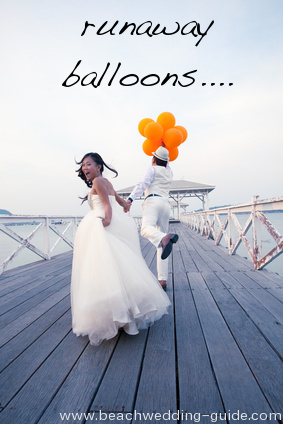 runaway balloons beach wedding photo