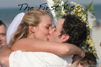 first beach wedding kiss