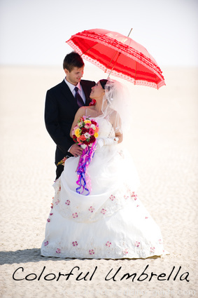 Umbrella beach wedding picture